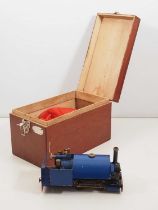 A live steam 32 mm gauge 0-4-0 saddle tank locomotive in blue livery in a wooden carry case - F/G in