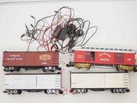 An unusual group of G scale American outline freight cars and combine cars all fitted with