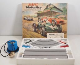 An AIRFIX MotorAce Grand Prix racing set, appears complete together with an unboxed SCALEXTRIC power