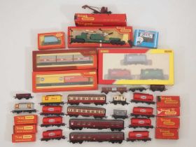 A large group of boxed and unboxed OO gauge wagons, wagon packs and coaches by HORNBY and others -