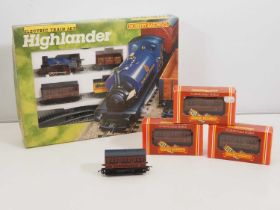 A HORNBY OO gauge 'Highlander' passenger and goods train set (appears complete) together with four