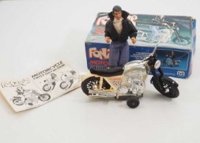 A MEGO 'Fonzie' battery operated motor cycle with figure complete with instructions - G in F box