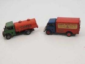 A pair of vintage TRIANG MINIC clockwork lorries comprising a fuel tanker and a delivery lorry - F/G