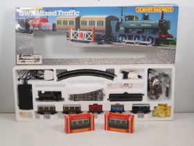 A HORNBY OO gauge GWR mixed traffic passenger and goods train set, appears complete together with