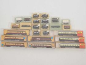 A mixed group of N gauge rolling stock comprising passenger coaches by MINITRIX and LIMA together