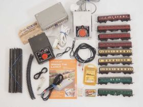 A quantity of TRIANG TT gauge rolling stock and accessories including unboxed coaches, transformers,