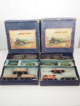 A pair of HORNBY O gauge clockwork train sets comprising No 501 Goods and Passenger sets in LNER
