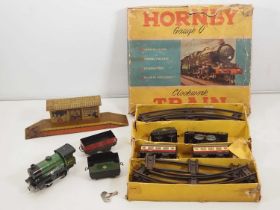 A HORNBY O gauge clockwork No 21 passenger set - F in P box together with another loco, wagon and