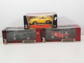 A group of 1:18 scale diecast cars by YAT MING and BBURAGO comprising 2 x MG TC Roadster together