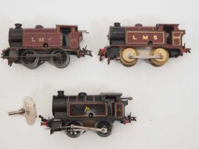 A group of HORNBY O gauge clockwork tank locomotives in LMS and BR black livery, one locomotive with