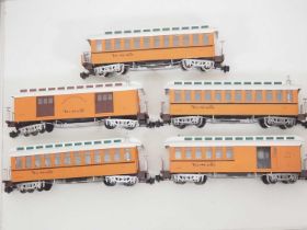 A group of BACHMANN G scale American Outline passenger cars all in Rio Grande livery, some with