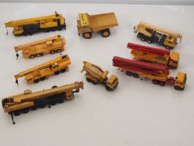 A quantity of diecast construction vehicles and cranes by manufacturers including NZG and CONRAD -