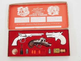 A BCM COMPANY (DERBY) 'Outlaw Presentation Case of Miniature Antique Firearms', appears mostly