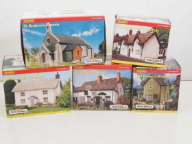 A village of HORNBY SKALEDALE OO gauge resin buildings to include cottages, a pub and a church - all