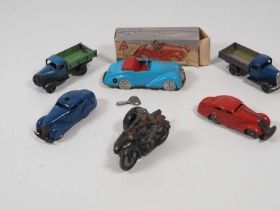 A group of vintage tinplate and elastolin vehicles to include a Lineol Hausser tinplate and