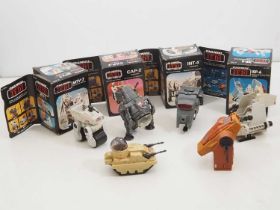 A group of vintage Star Wars (Return of the Jedi) guns and vehicles in original boxes together