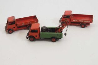 A group of vintage TRIANG MINIC clockwork lorries comprising 2 x flatbeds and a breakdown truck -