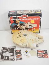 A vintage Star Wars (Empire Strikes Back) PALITOY Millennium Falcon in original box, with lightsaber