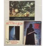 A group of autographed movie souvenir program books to include STAR WARS EPISODE IV: A NEW HOPE (