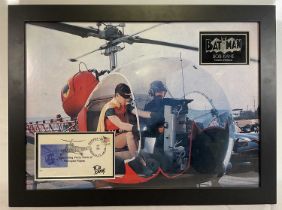 A BOB KANE signed envelope framed in a BATMAN display depicting Batman and Robin in the Batcopter,