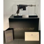 STAR WARS - A Master Replicas Han Solo Blaster in display case, with certificate of authenticity and