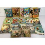 A collection of Rupert the Bear, Disney, and other children's annuals including Mickey Mouse,