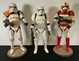 STAR WARS - A group of 3 Jakks Pacific Stormtrooper figures, two of which have been customised