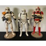 STAR WARS - A group of 3 Jakks Pacific Stormtrooper figures, two of which have been customised