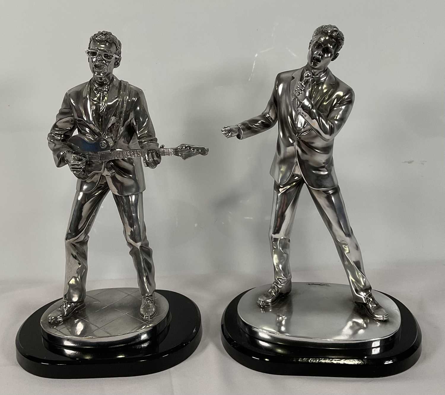 A pair of Silver Dreams by Leonardo (2005/6) statuettes of Cliff Richard and Hank Marvin in