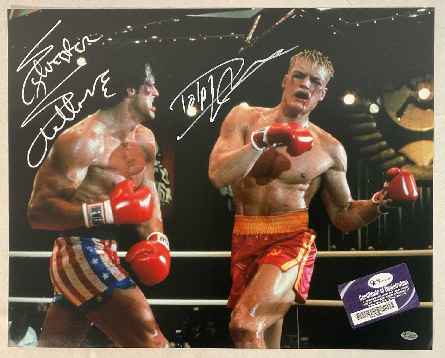 A 16" x 20" photographic still from ROCKY IV signed by SYLVESTER STALLONE and DOLPH LUNDGREN, with