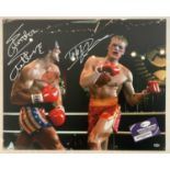 A 16" x 20" photographic still from ROCKY IV signed by SYLVESTER STALLONE and DOLPH LUNDGREN, with