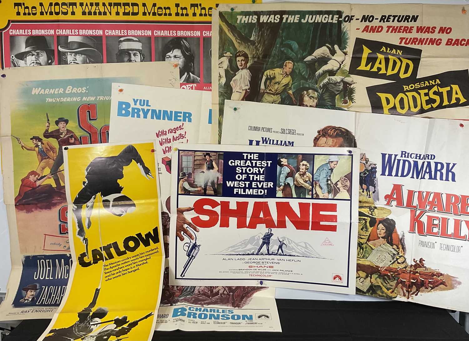 A group of Westerns movie posters comprising of SHANE (1953) US half-sheet 1966 re-release,