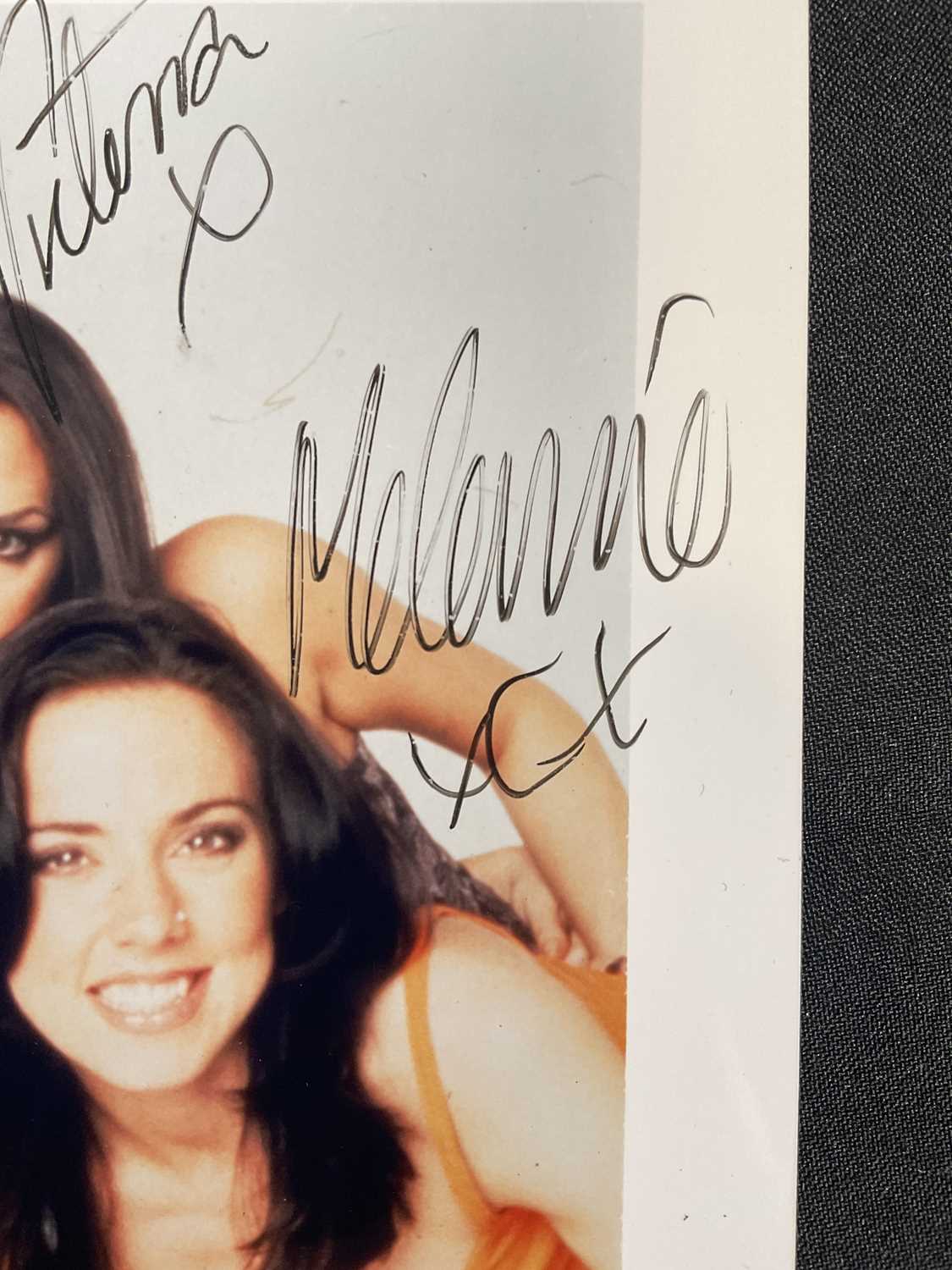 An 8" x 10" colour photograph of THE SPICE GIRLS signed by four members, EMMA BUNTON, VICTORIA - Image 5 of 5