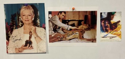 A group of 3 James Bond related autographed photographs comprising of JUDI DENCH, SHIRLY EATON and