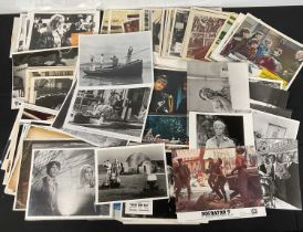 A quantity of lobby cards and promotional stills, titles include STAR WARS, PREDATOR 2, WAYNES
