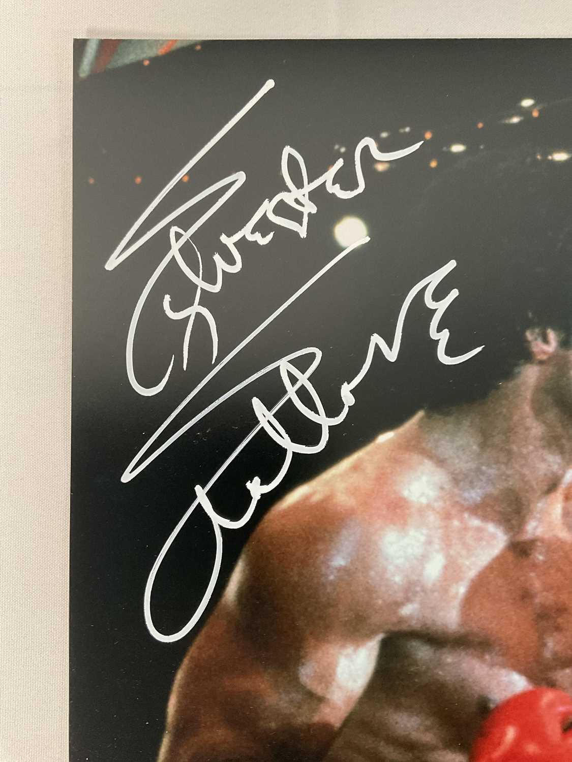A 16" x 20" photographic still from ROCKY IV signed by SYLVESTER STALLONE and DOLPH LUNDGREN, with - Image 2 of 4
