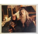 An autographed photographic still from HARRY POTTER signed by MICHAEL GAMBON (Professor Dumbledore),