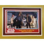 A STAR WARS Topps trading card signed by BILLY DEE WILLIAMS (Lando Calrissian), in a card frame