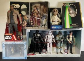 A group of collectible Star Wars action figures including Hasbro 1998 Primcess Leia and R2-D2,