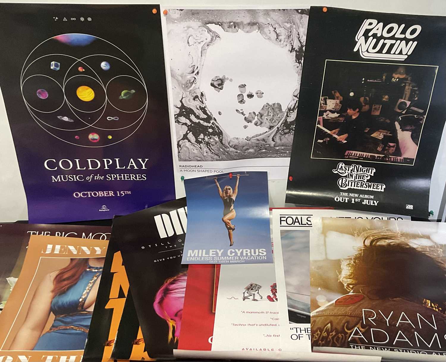 A quantity of Pop music album posters including RADIOHEAD, COLDPLAY, MILEY CYRUS, PAOLO NUTINI,