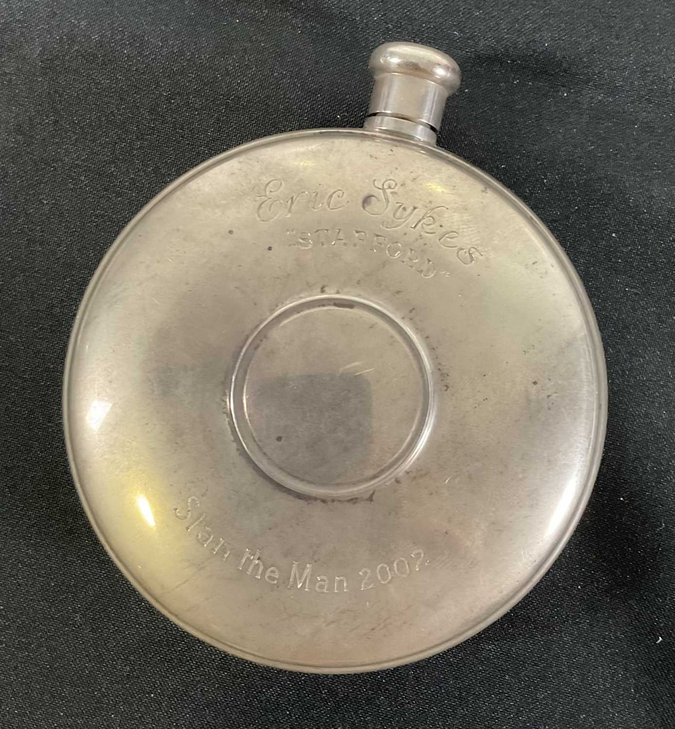 A sterling silver hip flask presented to ERIC SYKES for working on STAN THE MAN (2002) engraved with