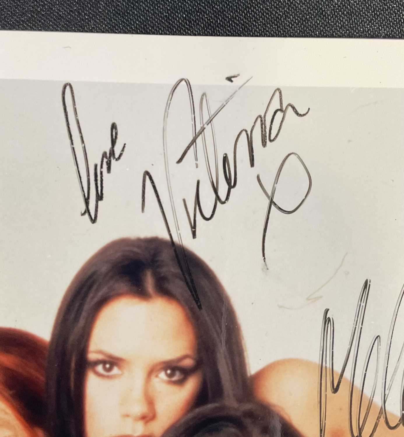 An 8" x 10" colour photograph of THE SPICE GIRLS signed by four members, EMMA BUNTON, VICTORIA - Image 3 of 5