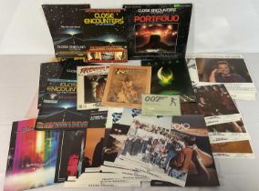 A collection of mostly Sci-Fi and Action souvenir program books, lobby cards and press packs to