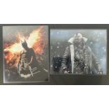 A pair of large format photographic stills from BATMAN THE DARK KNIGHT RISES signed by CHRISTIAN