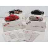 A group of 1:24 scale DANBURY MINT diecast cars to include a 1940 Ford Deluxe Coupe and a Jaguar
