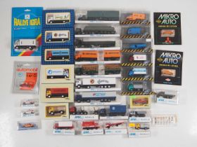 A group of 1:87 scale plastic cars, vans and lorries mostly by IGRA - VG/E in VG boxes (Q)