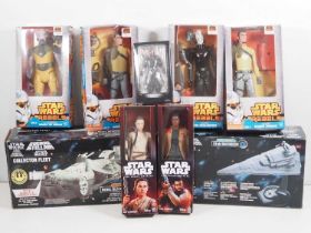 A group of modern STAR WARS action figures in the 'The Force Awakens' and 'Rebels' series together