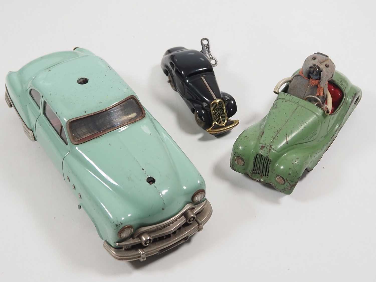 A group of SCHUCO vintage tinplate vehicles comprising a boxed submarine and three cars - F/G in F/G - Image 2 of 6