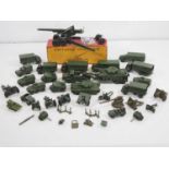 A large quantity of diecast military vehicles and accessories by DINKY, BRITAINS and others - F/G in