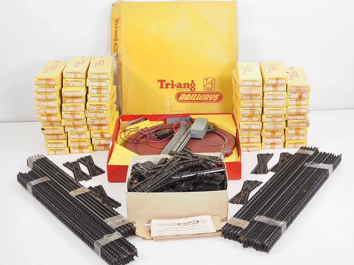A large quantity of TRIANG TT gauge boxed and unboxed track together with a boxed turntable - G in
